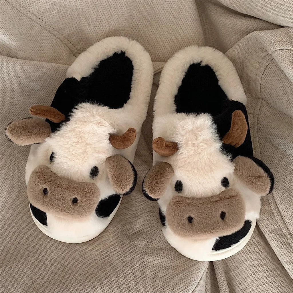 White women's cow slippers with plush faux fur upper and textured non-slip soles