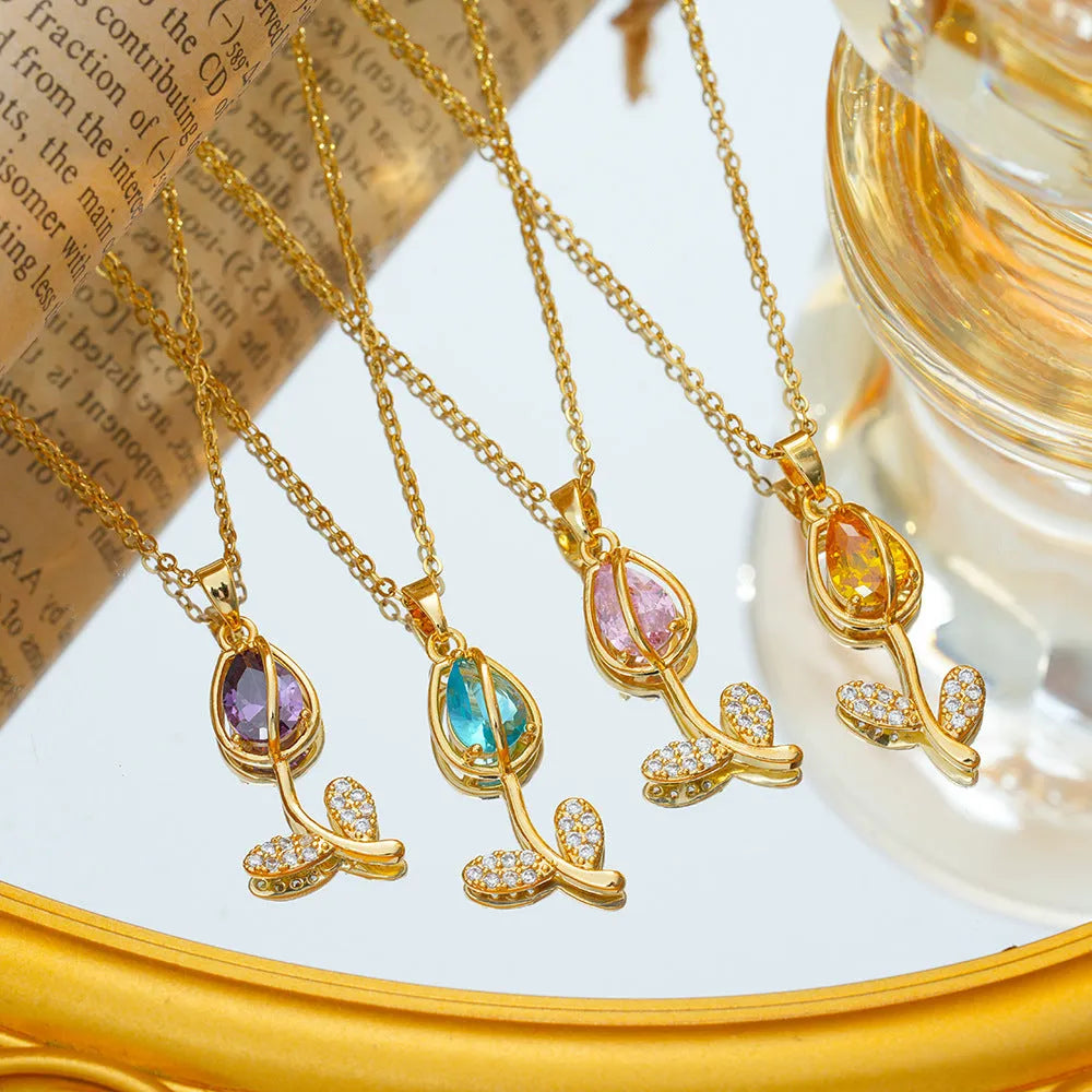 Zircon tulip necklace for women in gold tone with flower pendant on adjustable O-ring chain.