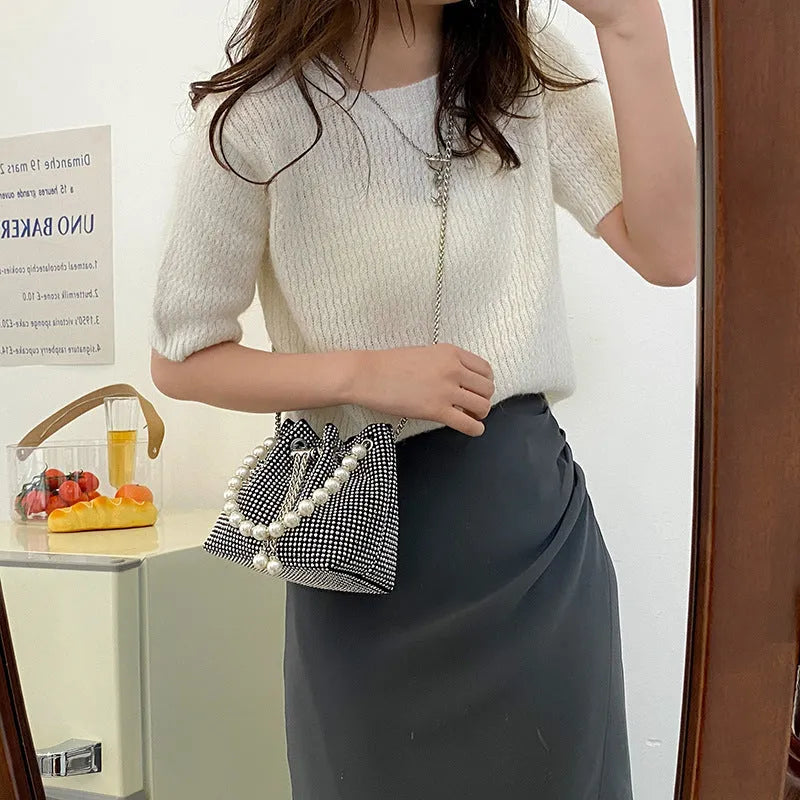 Women's diamond pattern PU leather crossbody shoulder bag with Western chain detailing and bucket shape