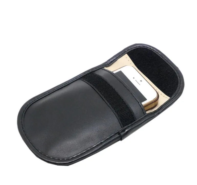 Black microfiber Faraday cage bag for blocking car key and phone signals, measuring 13.5 by 9.5 cm.