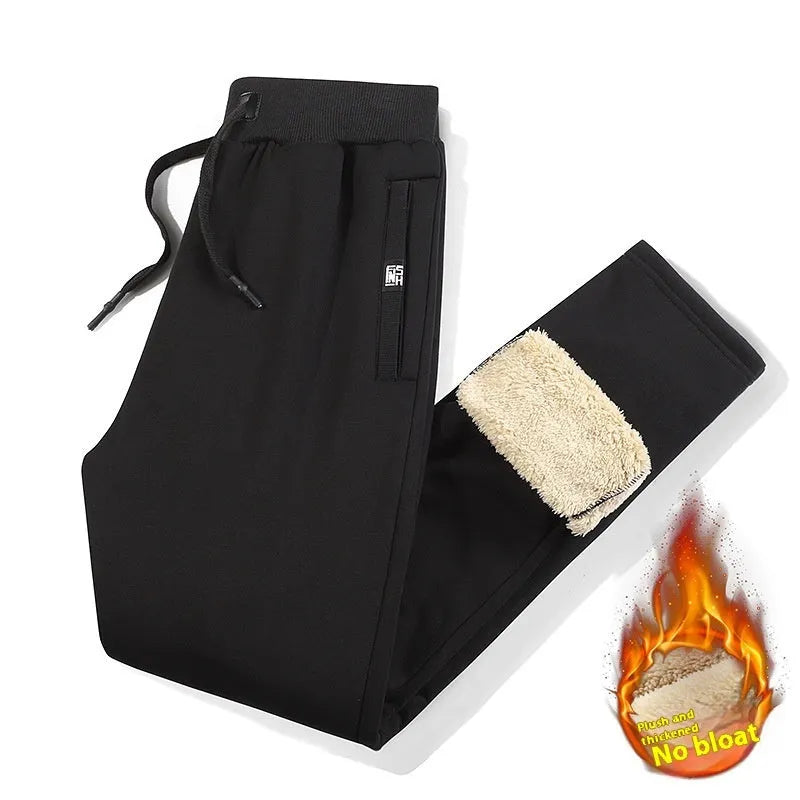 Men's grey fleece-lined cotton track pants in oversized style showing drawstring leg detail