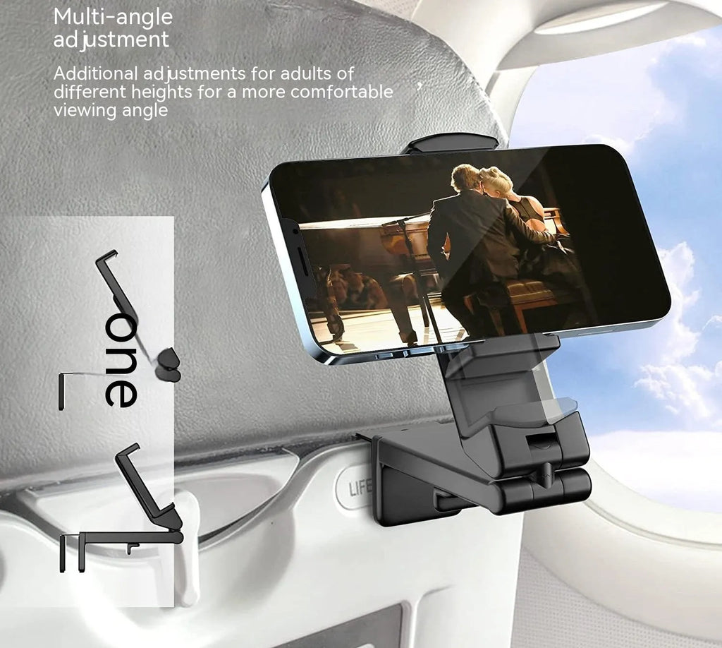 Black foldable rotating phone holder holding a mobile phone on a desk.
