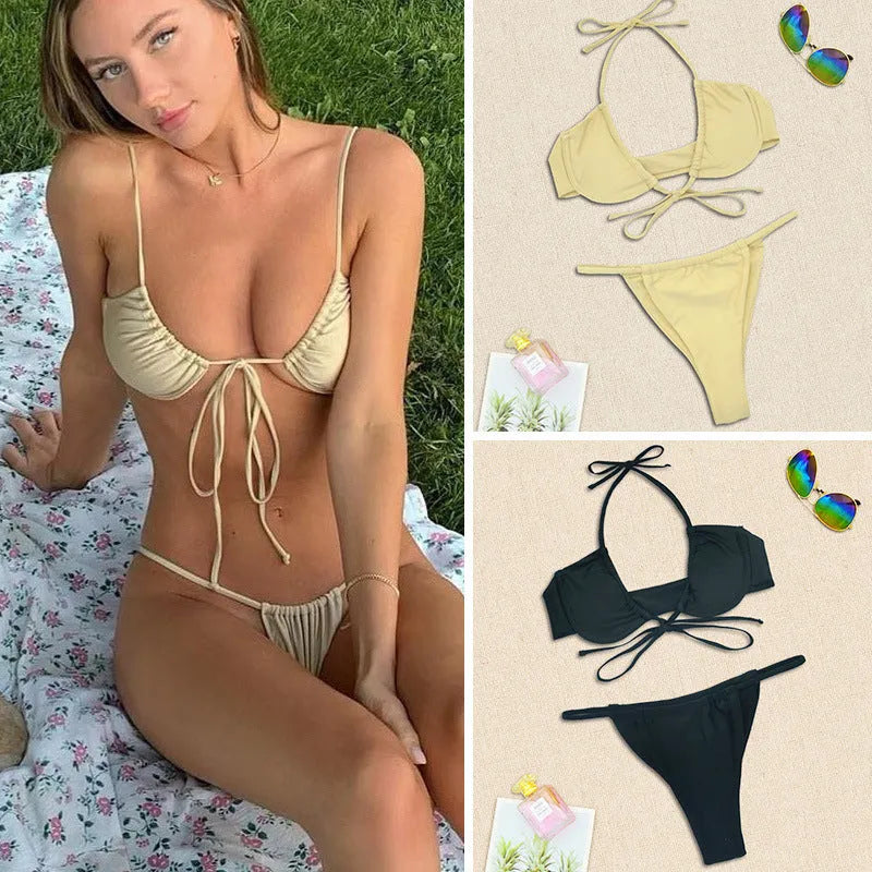 Women's two-piece black and mint green bikini swimsuit with split design