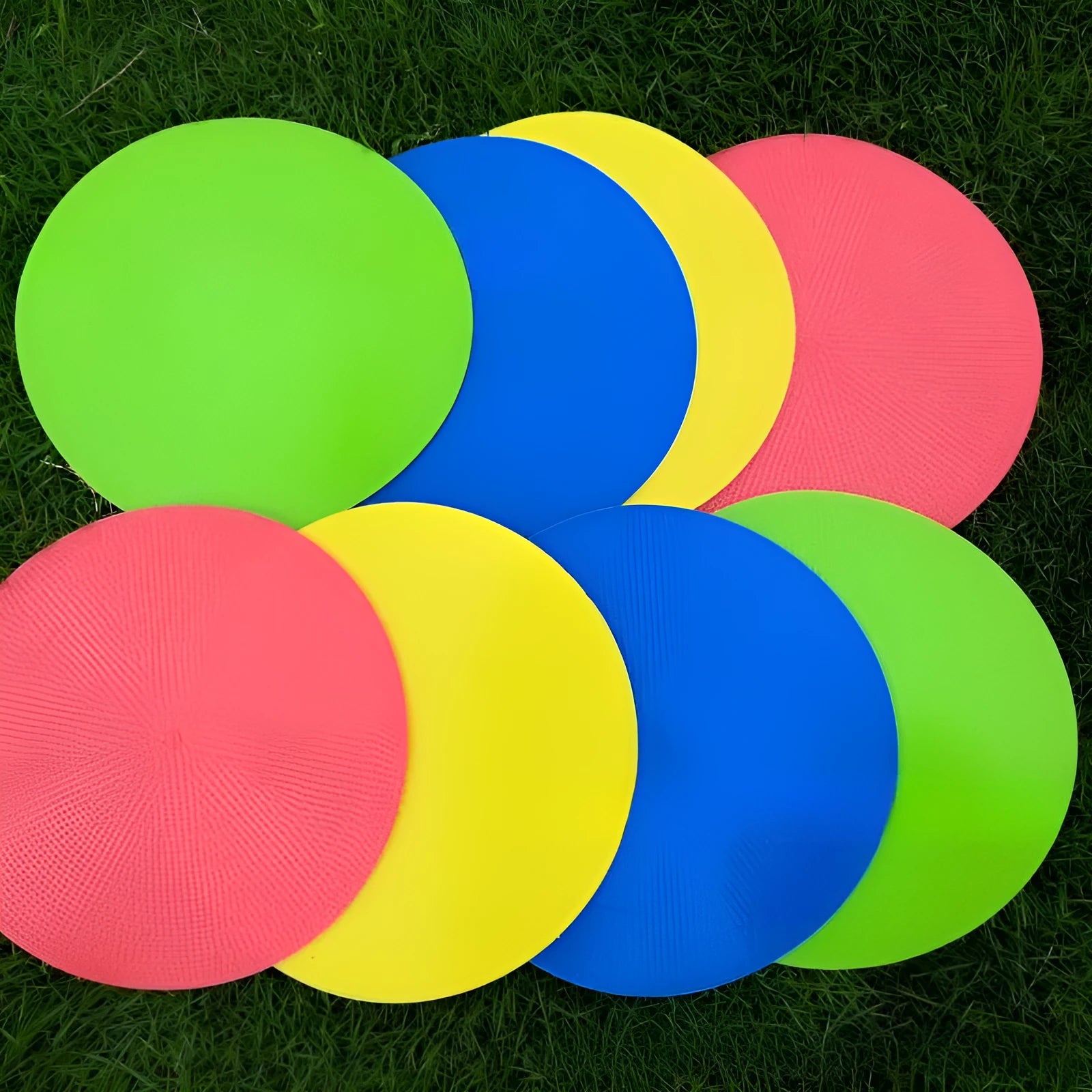 Coloured TPE football training disc marker 23cm diameter on grass field