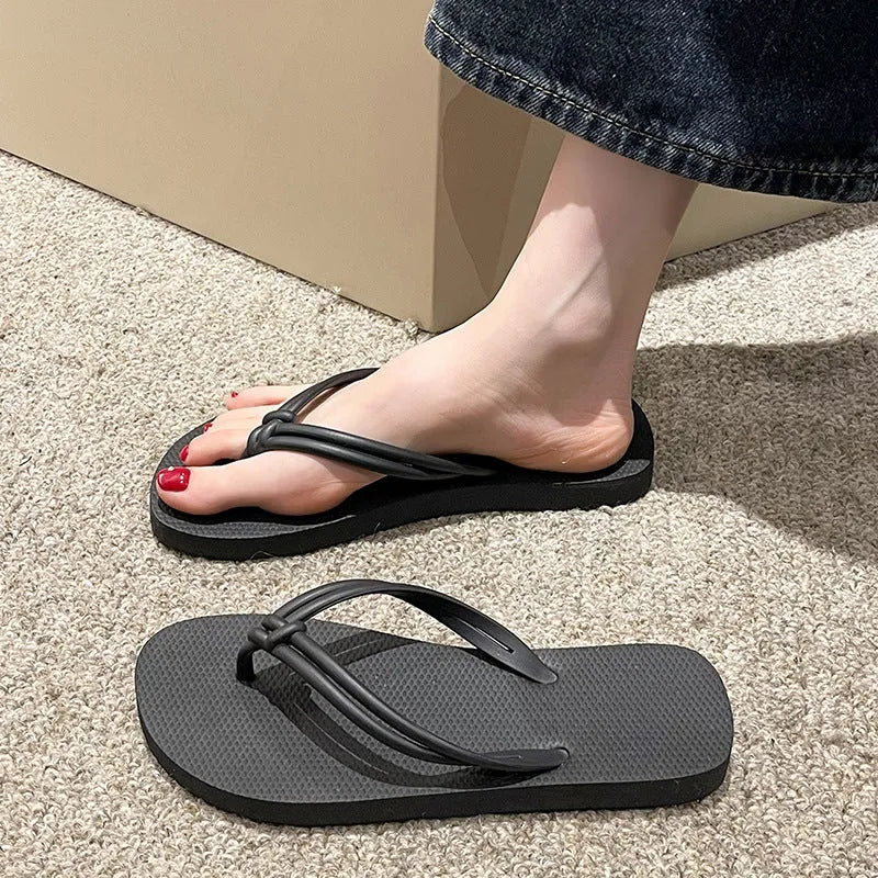 Men's casual flip flops with toe covering in PVC material, showing non-slip sole pattern and full foot enclosure design