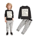 Casual cotton two-piece clothing set for a boy, featuring a long-sleeved T-shirt with letter print and matching trousers.