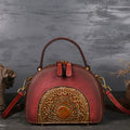 Vintage cowhide suede leather handbag showing internal organisation compartments including ID pouch and mobile phone section