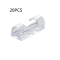 Transparent plastic self-adhesive cable clips in four size variants for wire organisation