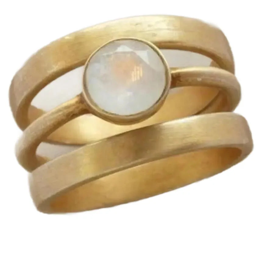 Gold plated geometric ring with micro-inlaid white chalcedony stone on a simple band.