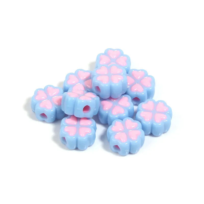 Assorted light-coloured acrylic clover-shaped beads with frosted finish, 15mm size.