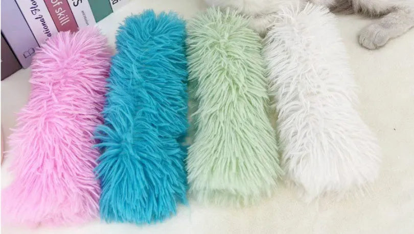 Soft plush cat toy pillow in blue, green, pink, or white, measuring 27cm by 10cm