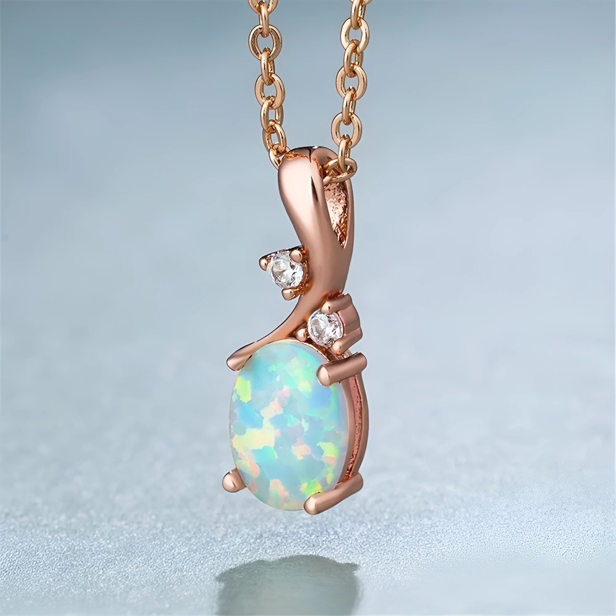 Water drop shaped opal pendant necklace on O-chain with rose gold or white electroplated finish