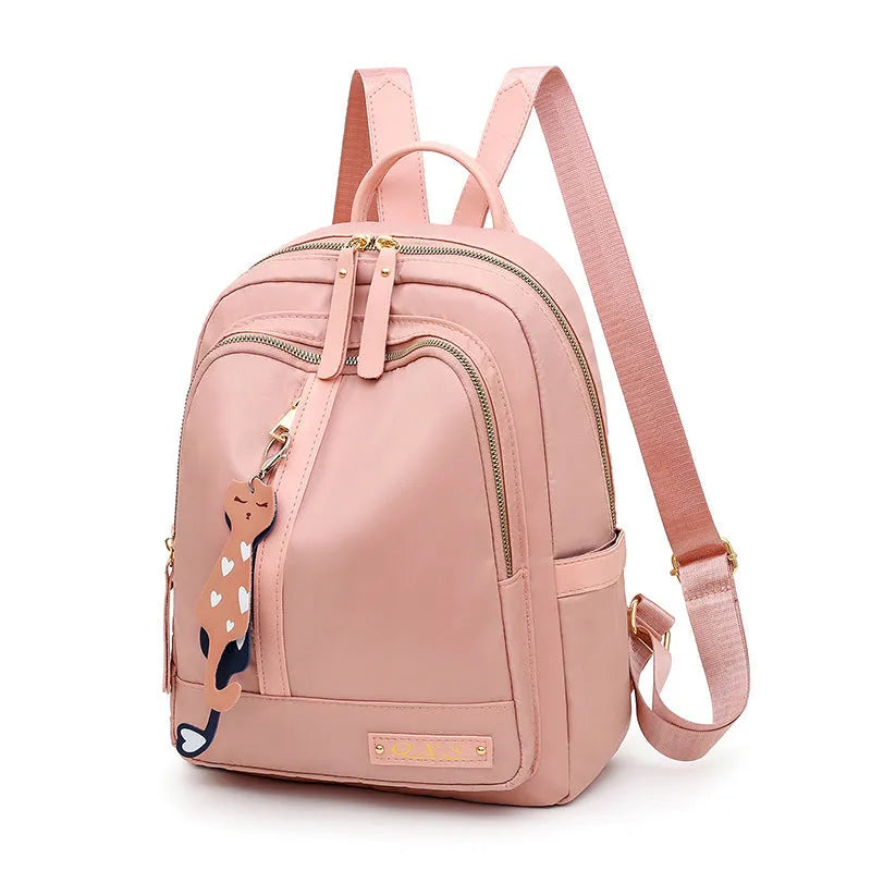 Black women's casual nylon backpack showing square vertical shape with shoulder straps and external pockets
