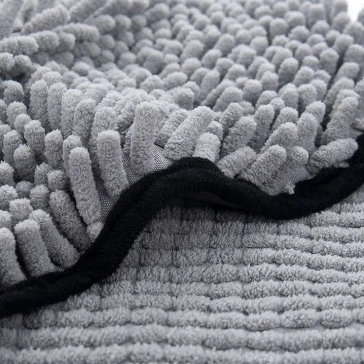 Blue dog bath towel with quick-dry absorbent fibre, measuring 62cm by 23cm.