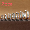 Perforated circle zircon stud earrings in gold, rose gold, or silver colour on white background