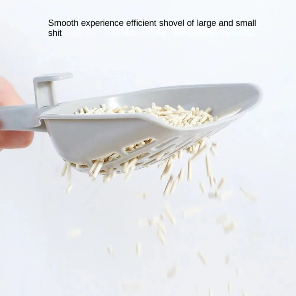 Grey plastic cat litter scoop with a built-in waste-catching base on a white background.