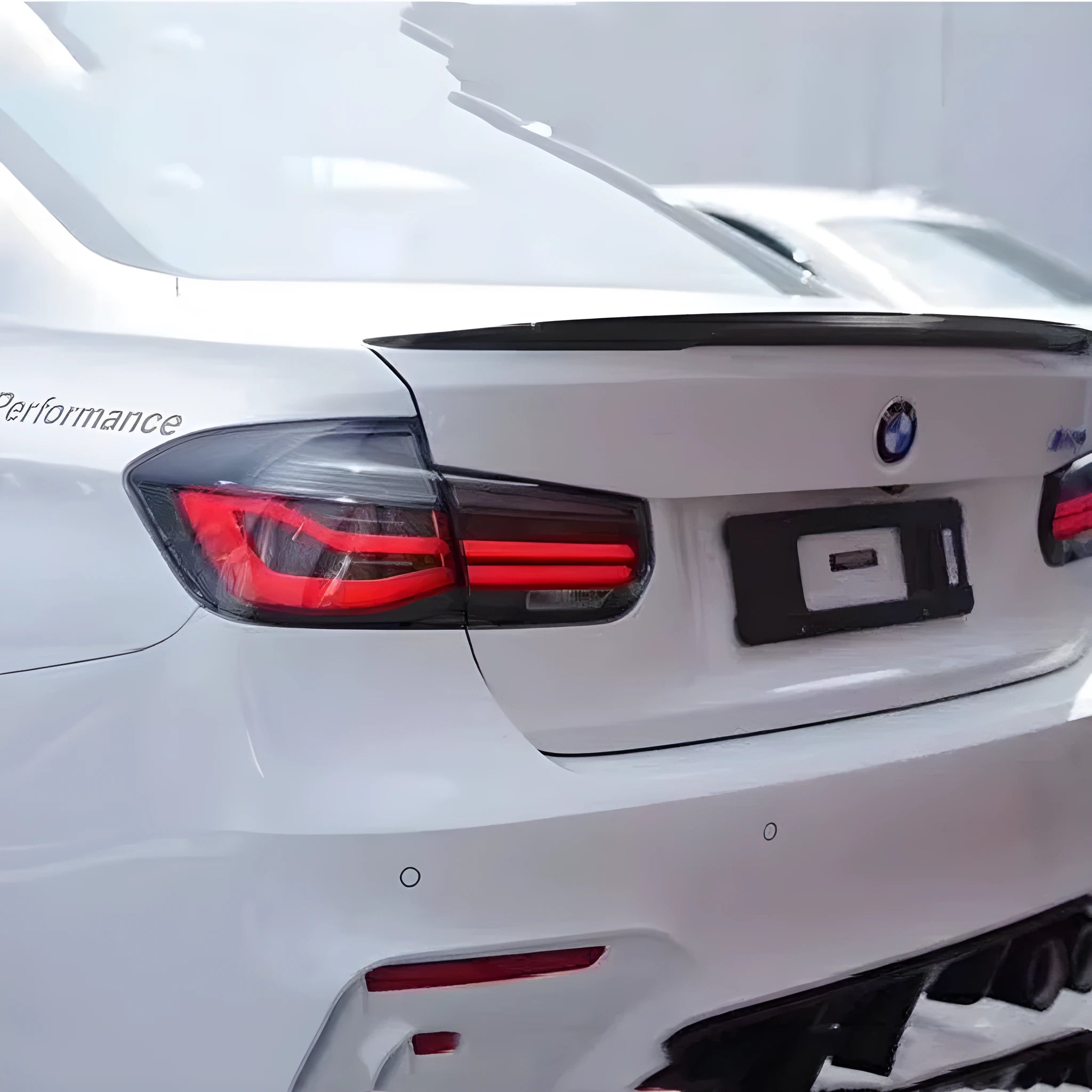 BMW 3 Series F30 tail light assembly with LED streamer running light in red or smoked black finish for 2012-2015 models