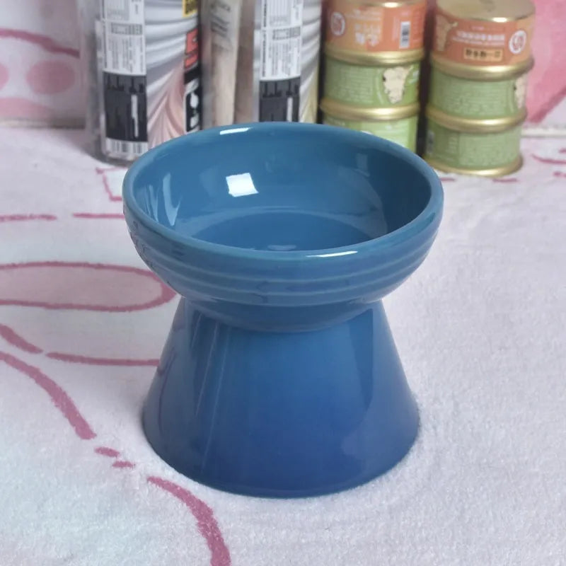 High-foot ceramic pet bowl with chin protector and anti-tumble base design