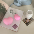 Vinyl atmosphere lamp emitting warm glow light, available in pink or white colours with battery operation