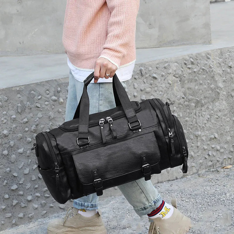 Black travel bag with shoe compartment measuring 52cm long, 19cm wide and 27cm high