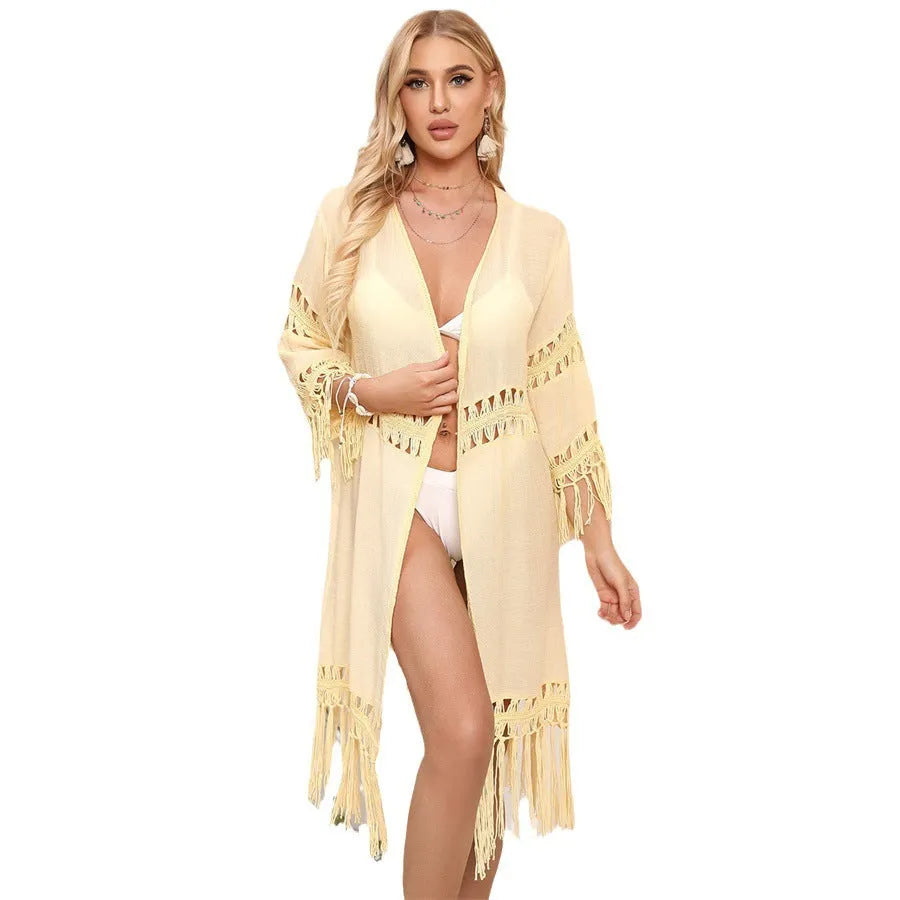 Yellow hand crocheted women's cardigan with tassels, a beach cover-up.