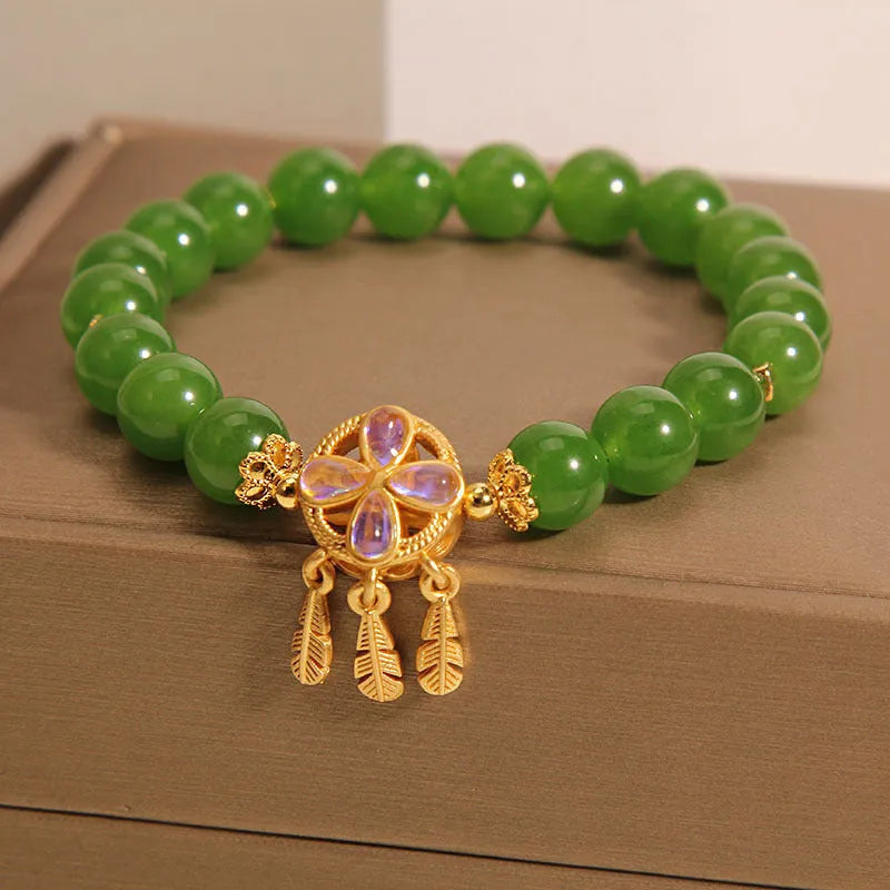Green jasper crystal bracelet for women with four-leaf clover dream catcher pendant.