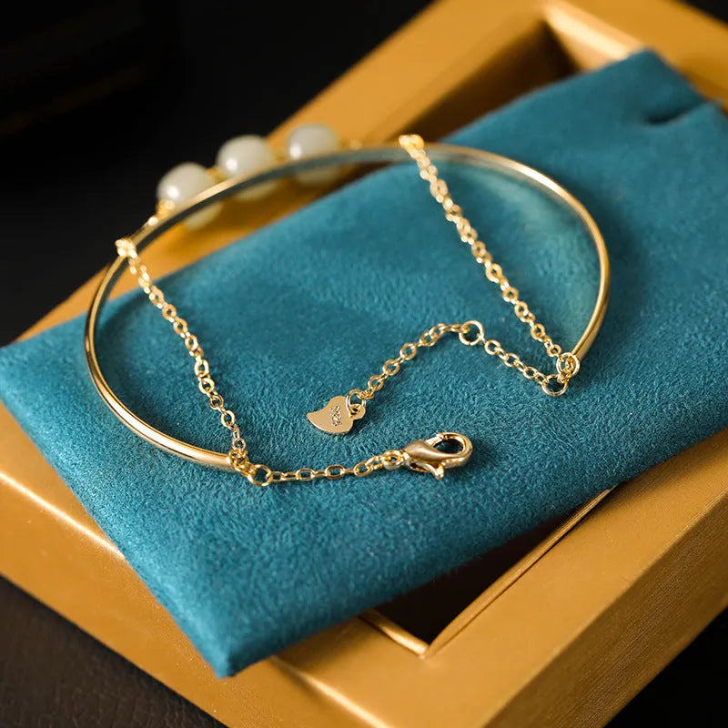 Jade lucky beads bracelet for women with gold inlay, shown in single, double, and three bead versions.