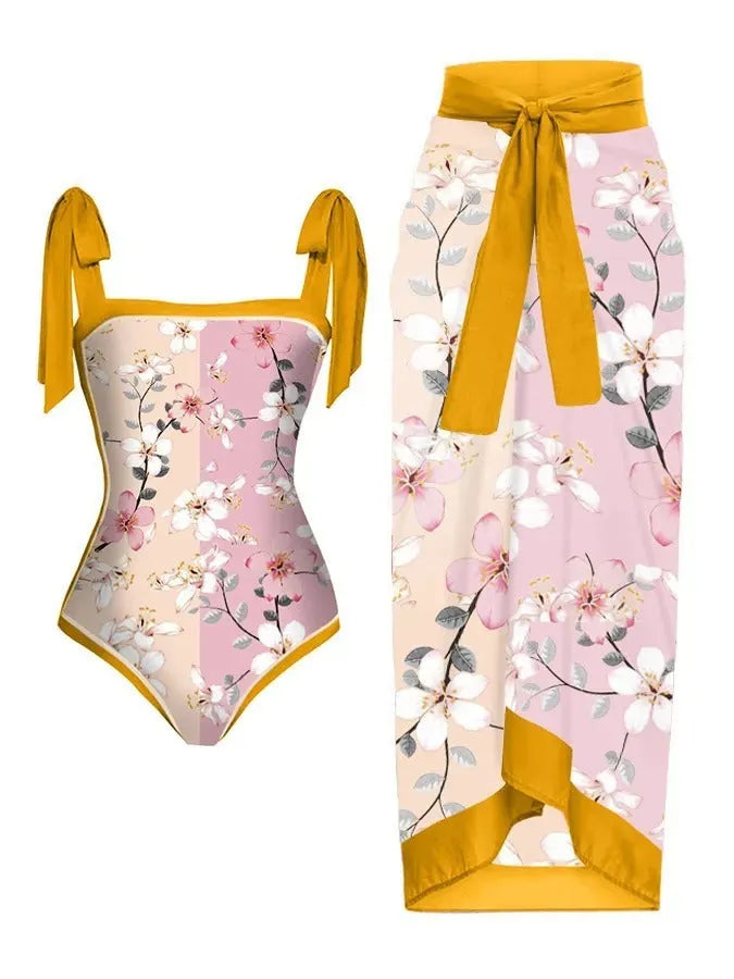 Women's printed chiffon two-piece swimsuit set with matching hip skirt in floral design