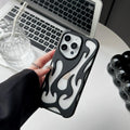 Apple iPhone case with hollow flame pattern and electroplated finish in silver, shown on a phone.