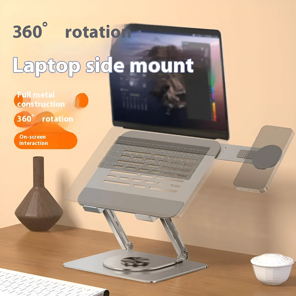 Silver carbon steel laptop stand with rotating top and a side-mounted magnetic mobile phone holder.