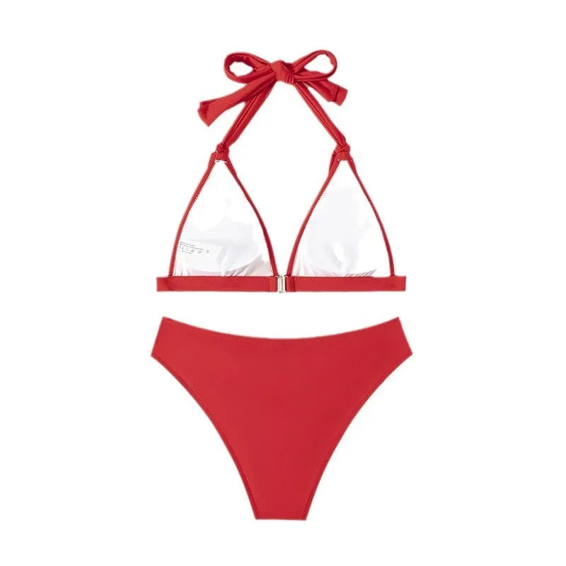 Red women's halterneck lace-up bikini top and shorts set on a mannequin.
