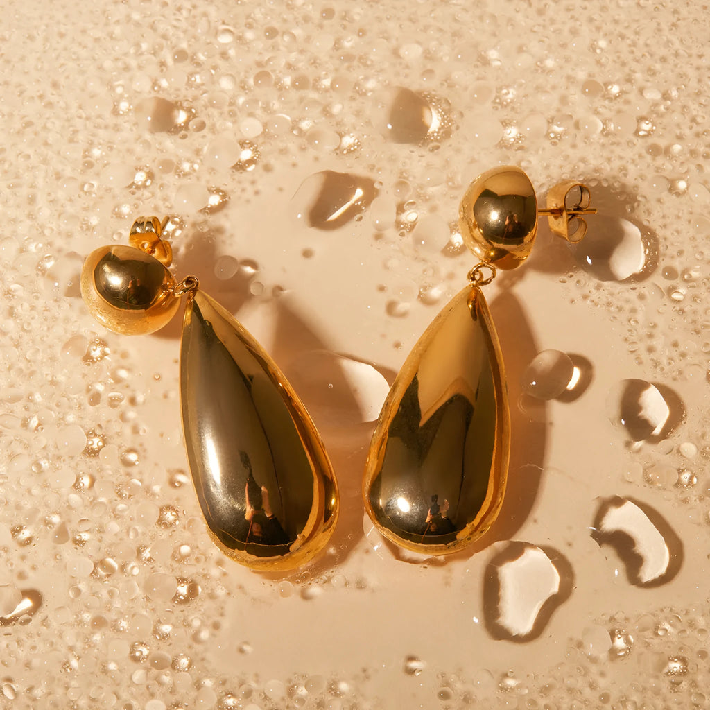 Gold geometric water drop earrings with hemisphere pendant design on stainless steel