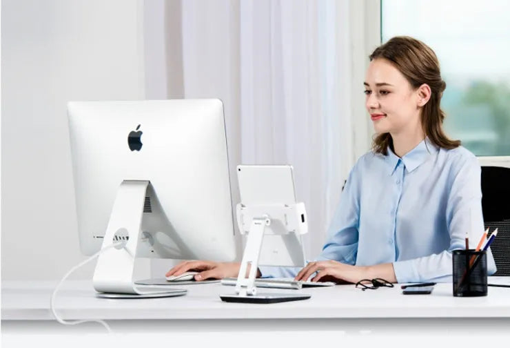 Folding desktop phone tablet stand in silver with 360-degree rotation feature