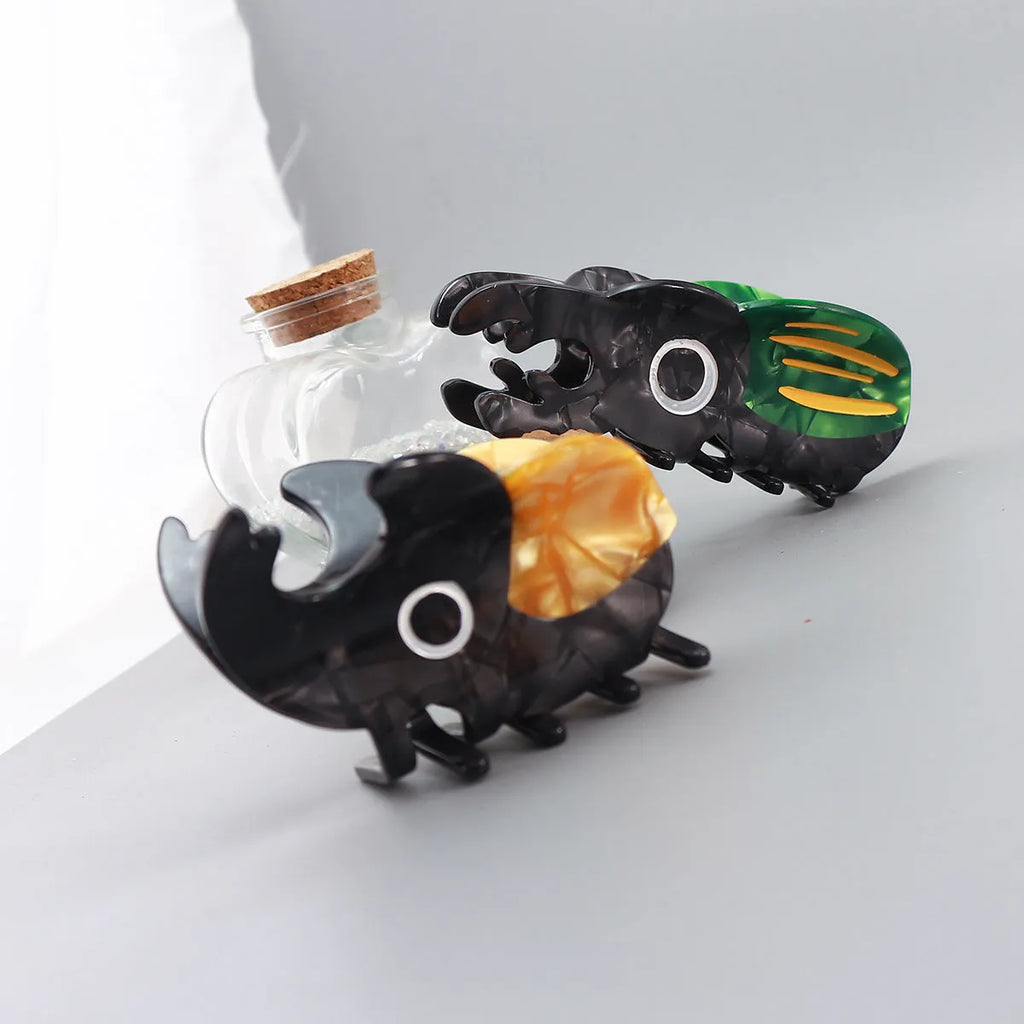 Handmade cellulose acetate Beetle Grip with cartoon caterpillar design in green or orange beetle colours