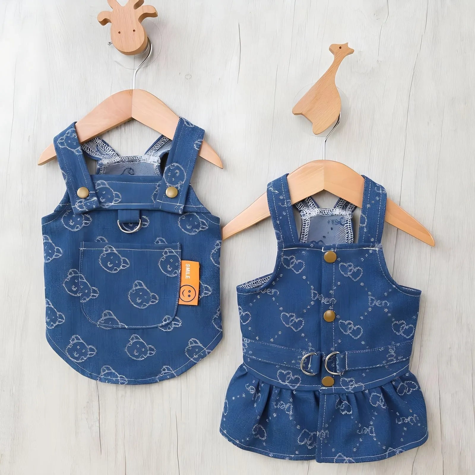 Small dog wearing a denim Princess dress in a bracket-skirt style.