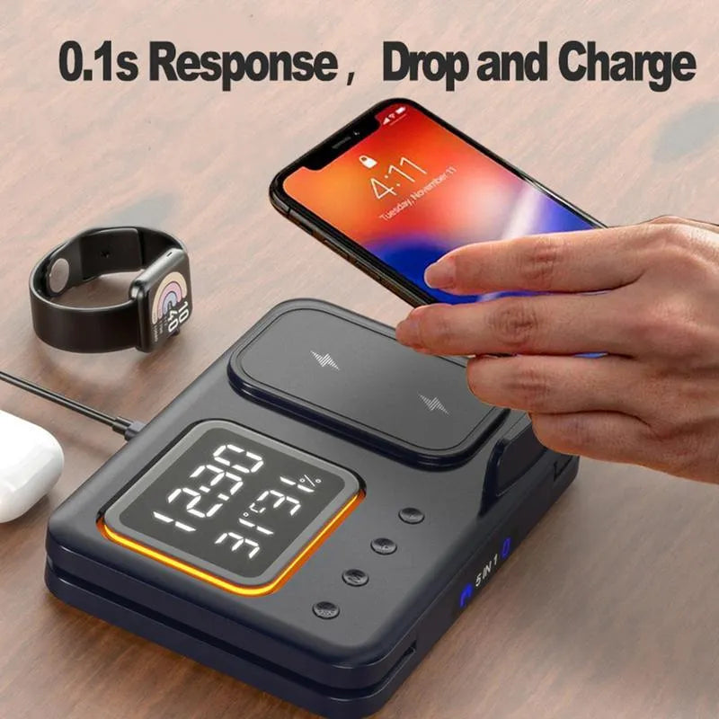Black and white wireless charging station with phone, watch, and headphones on dock, showing LED time and temperature display.