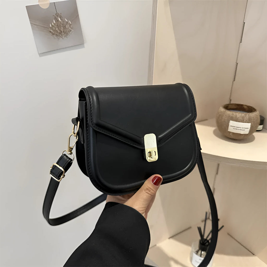 Soft PU messenger bag with textured finish and clamshell opening in horizontal square shape