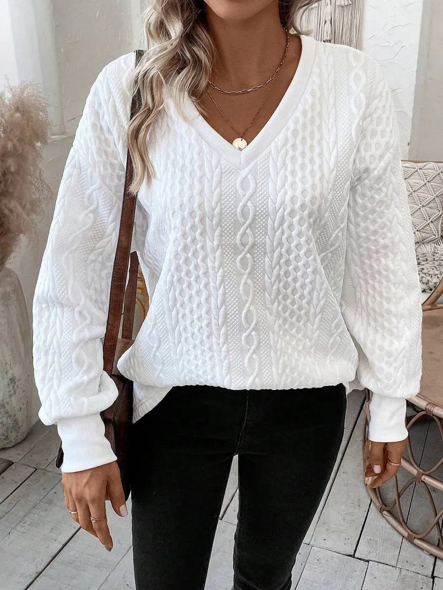 Milky white loose fit casual t-shirt with a raised 3D pattern on the front.