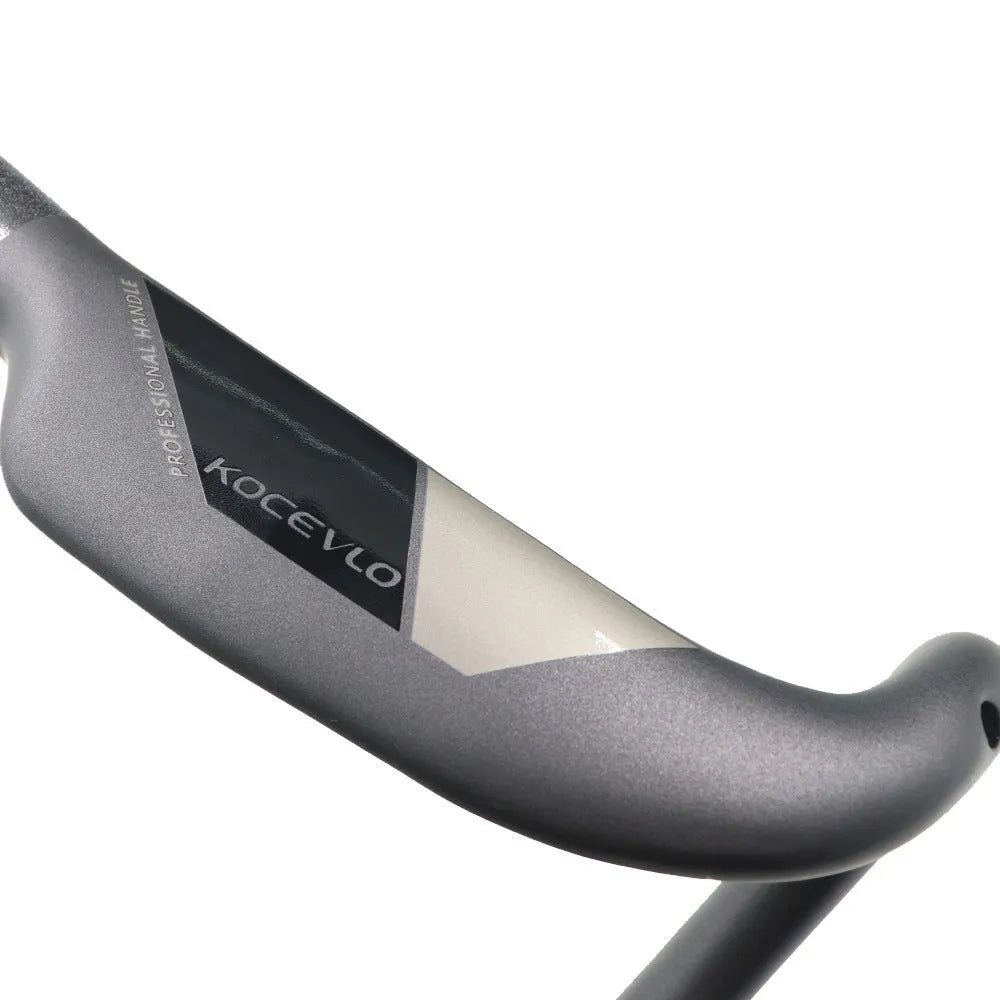 Wei Bike matt carbon fibre bent road bicycle handlebar showing its curved shape.