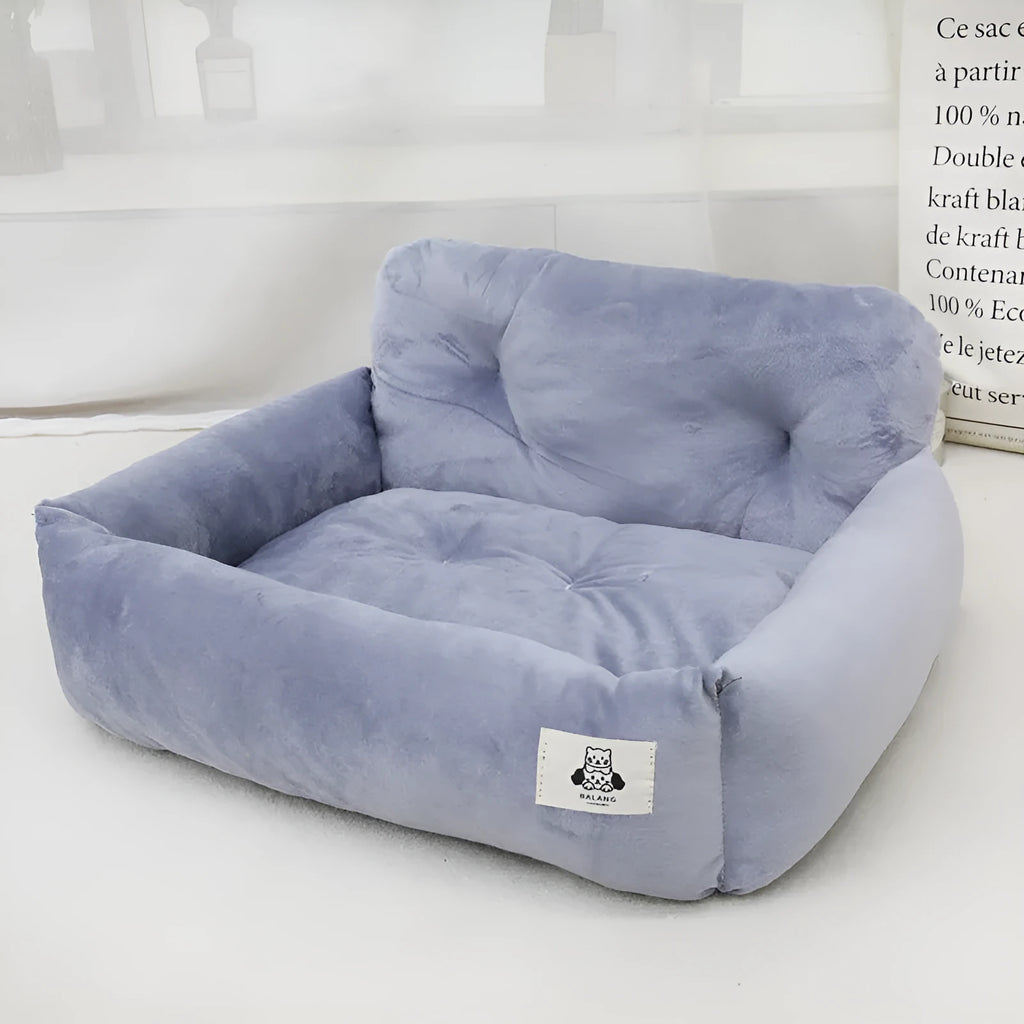 Car-mounted pet carrier nest in blue plaid cloth for dog transport