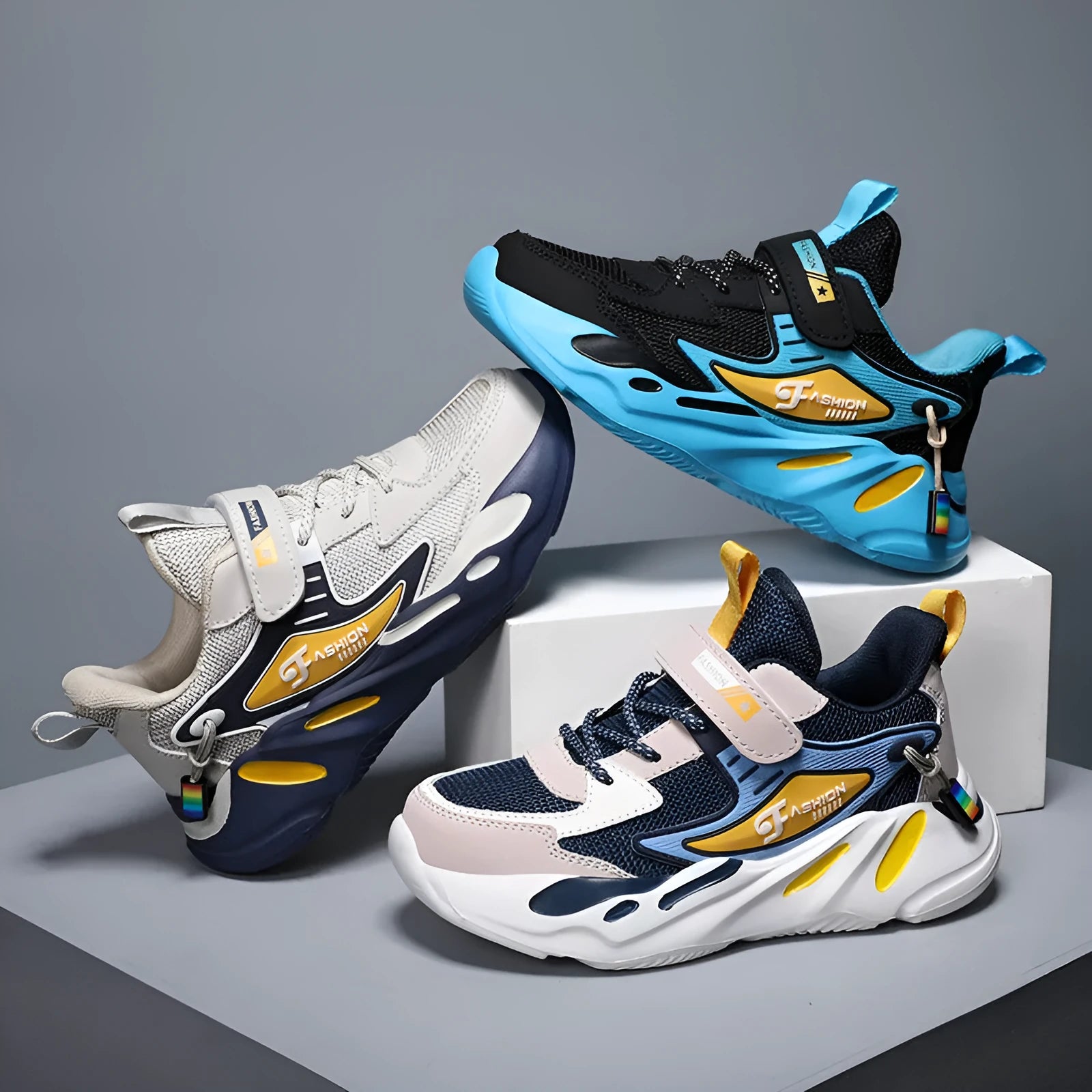 Boys' blue and black Velcro fastening sports shoes with a textured non-slip sole.