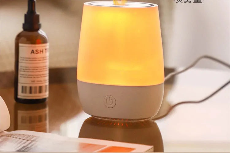 White USB aroma diffuser with simulated flame effect showing mist output