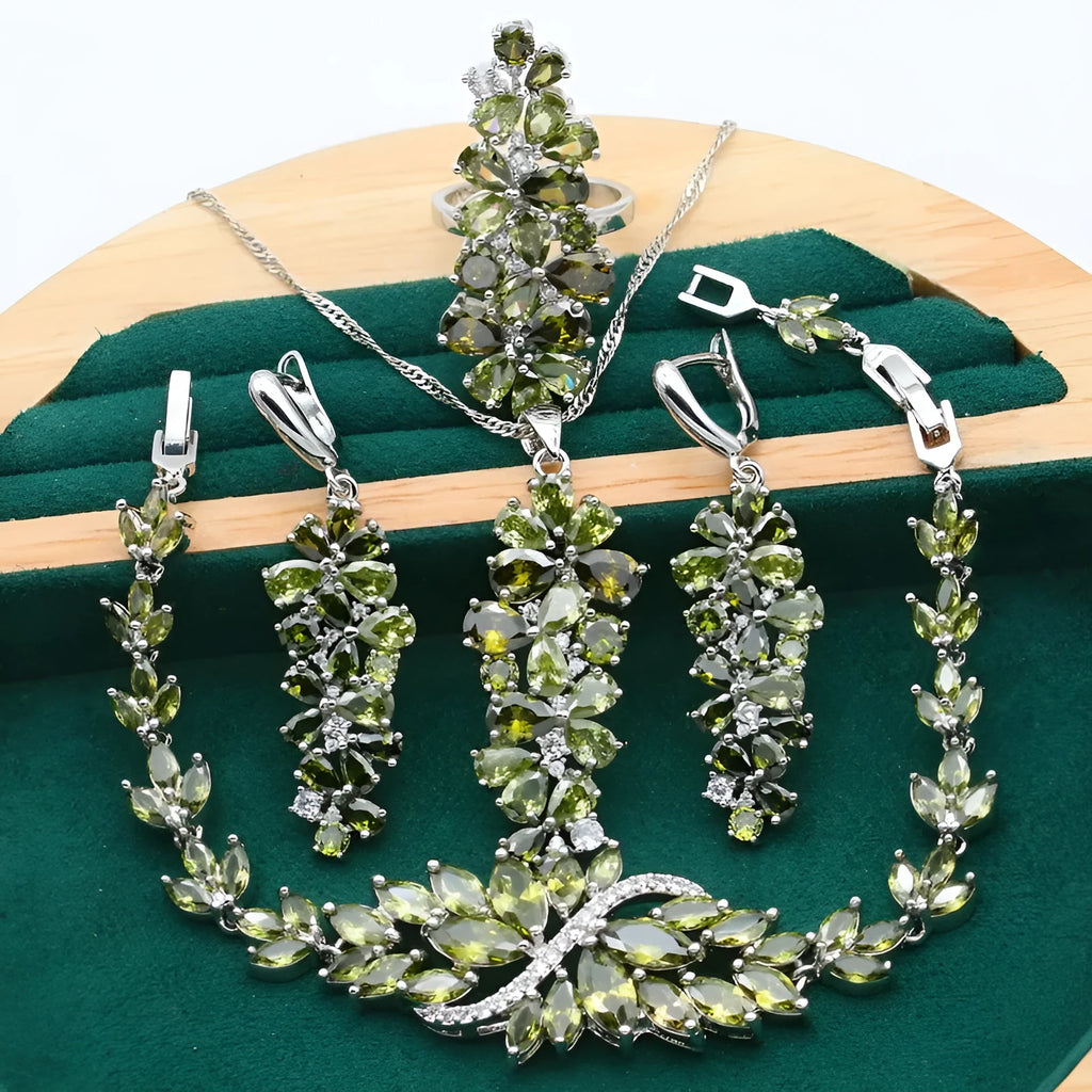 Retro jewellery set with plants and flowers design showing necklace, earrings, ring and bracelet in olive purple colours