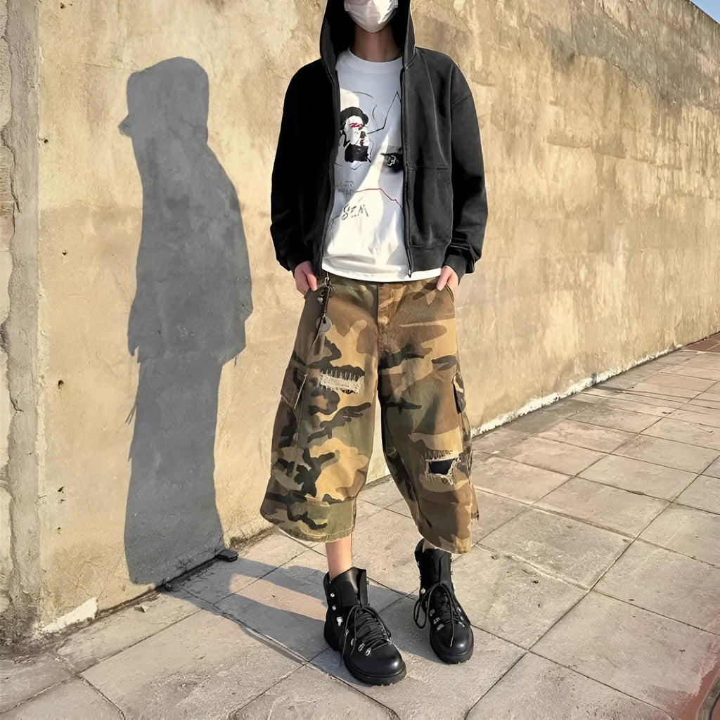 Men's straight-leg cropped jeans in camouflage pattern with patchwork detailing and distressed rips