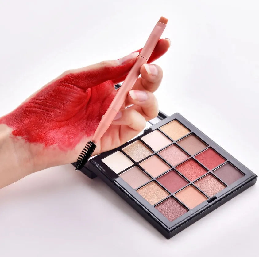 Ten professional makeup brushes with wooden handles arranged in a set, including powder, foundation and detail brushes