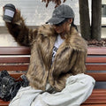 Artificial fur coat with fur collar in short 40cm length showing black tip on black colour variation