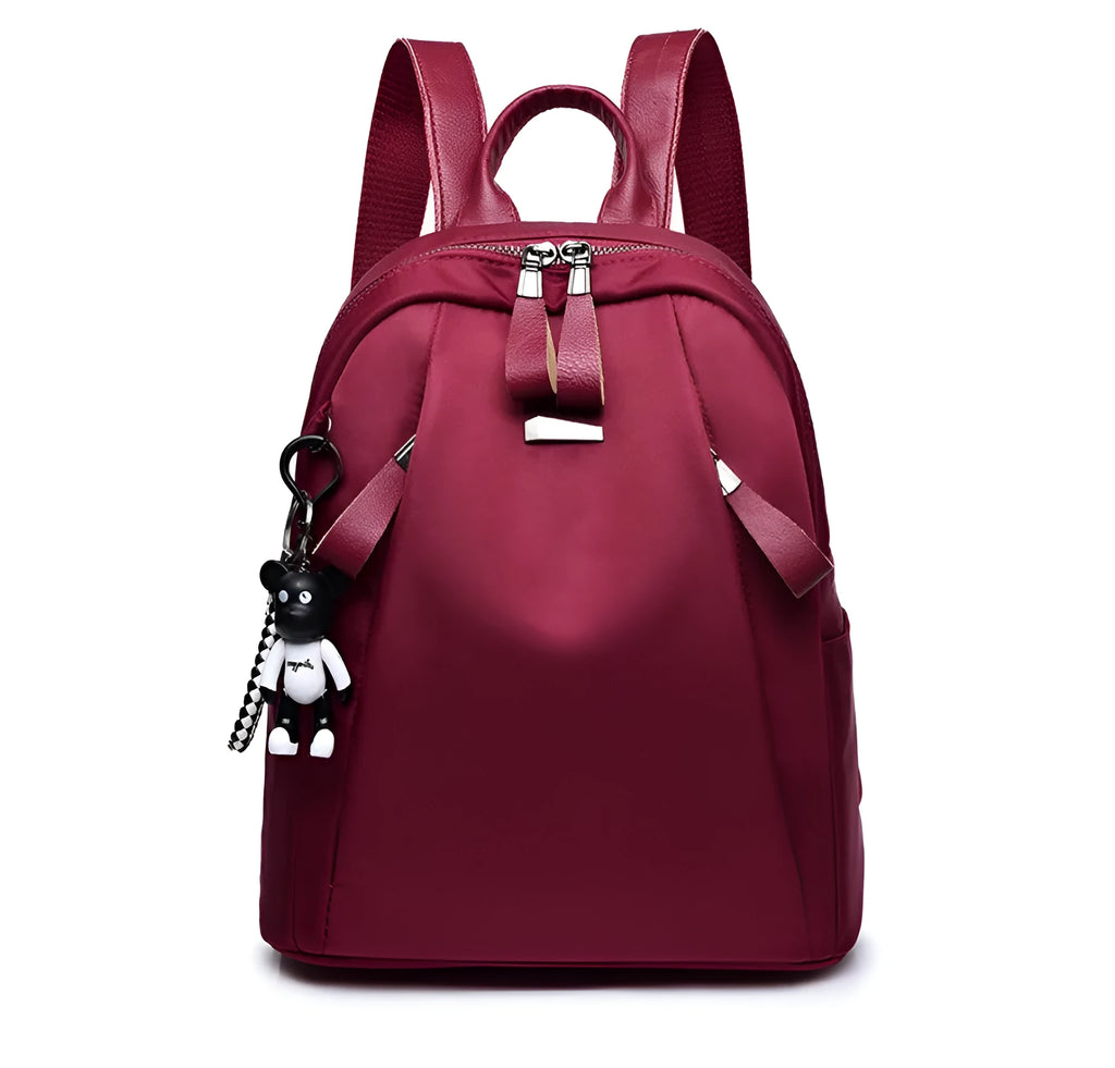 Medium capacity Oxford cloth rucksack in wine red with double straps and organised internal compartments