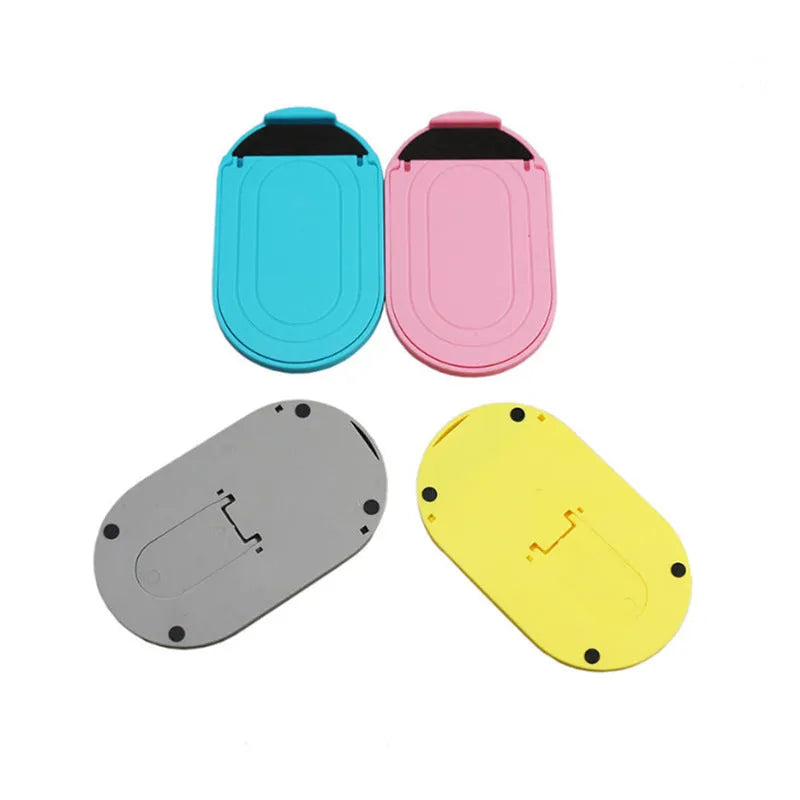 Adjustable plastic mobile phone stand in various colours holding a smartphone