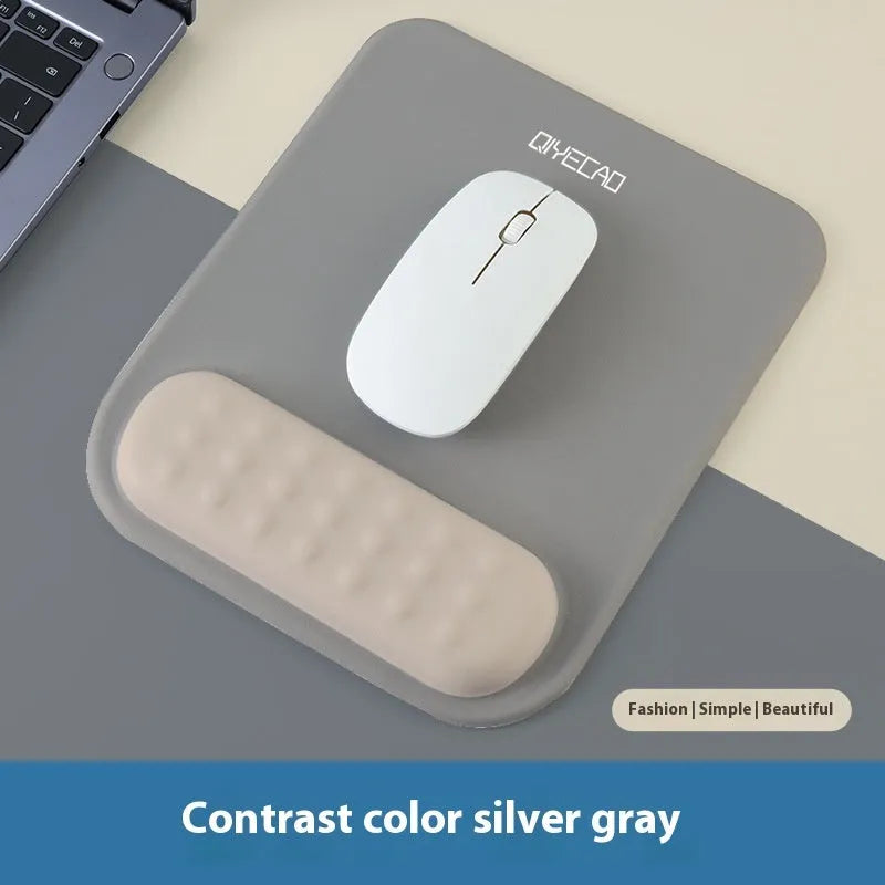 Ergonomic mouse pad with raised wrist support in cloth silicone material showing colour options