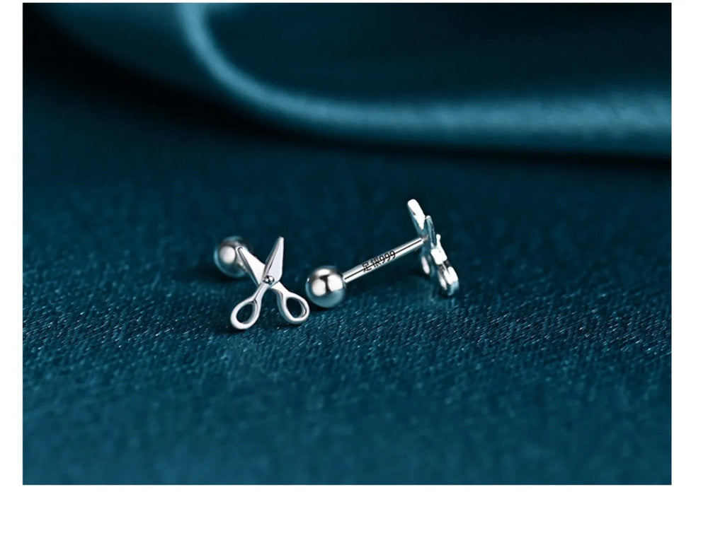 A pair of S999 pure silver screw ear nails with a mini scissors motif.